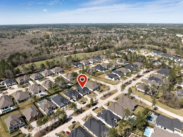 birds eye view of property with a residential view