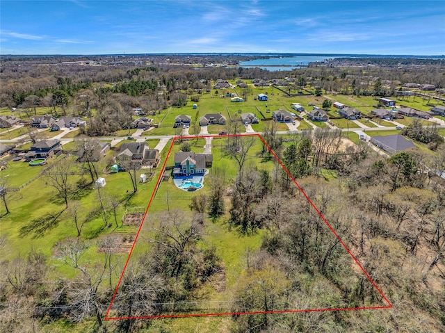 birds eye view of property featuring a water view