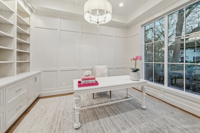 office area with a decorative wall, recessed lighting, and dark wood-style floors