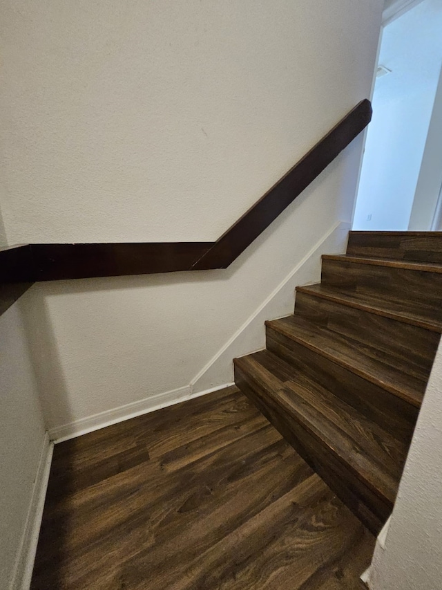 stairs with wood finished floors