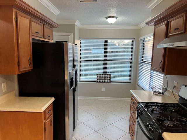 kitchen featuring refrigerator with ice dispenser, light tile patterned flooring, crown molding, light countertops, and black range with gas cooktop