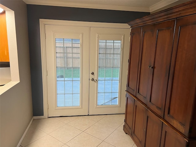 entryway featuring crown molding, light tile patterned floors, french doors, and baseboards