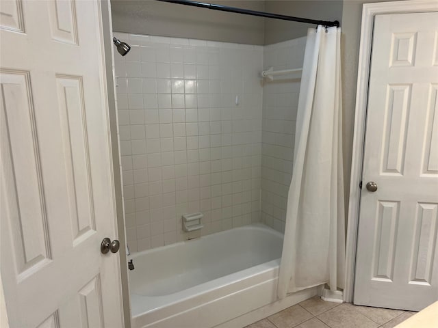 bathroom featuring shower / bath combo and tile patterned flooring