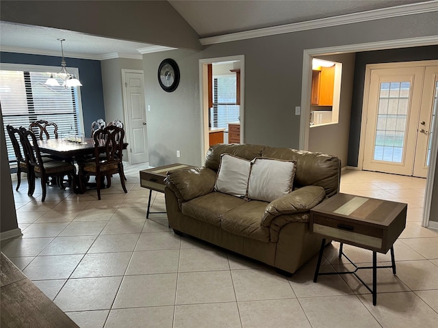 living area with light tile patterned floors, lofted ceiling, and crown molding