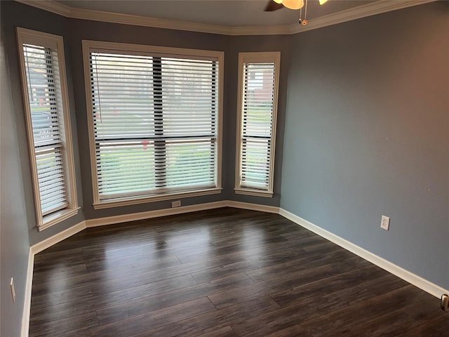 unfurnished room featuring baseboards, ceiling fan, dark wood-style flooring, and crown molding