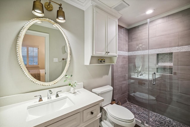 bathroom with visible vents, a shower stall, toilet, ornamental molding, and vanity