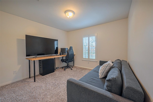 office area with light carpet and baseboards