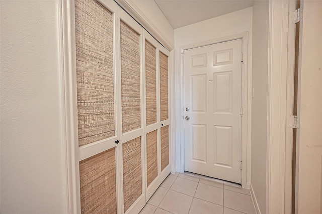 entryway with light tile patterned floors