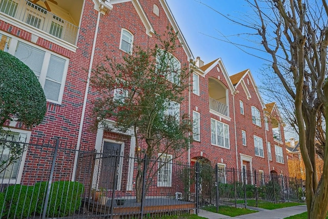 view of building exterior featuring fence