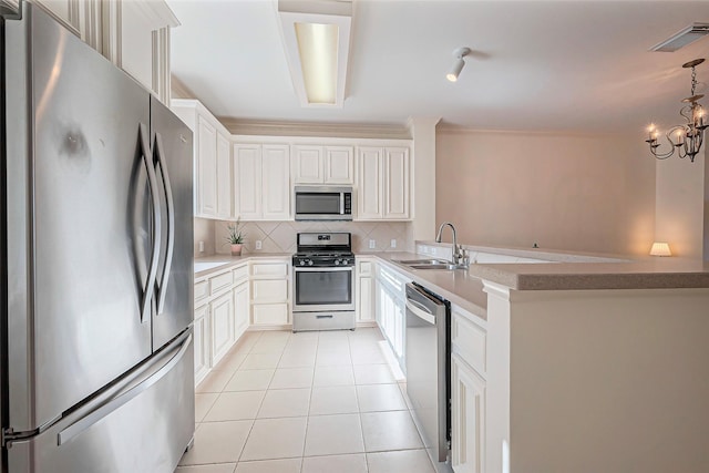 kitchen with visible vents, backsplash, light tile patterned floors, appliances with stainless steel finishes, and a sink