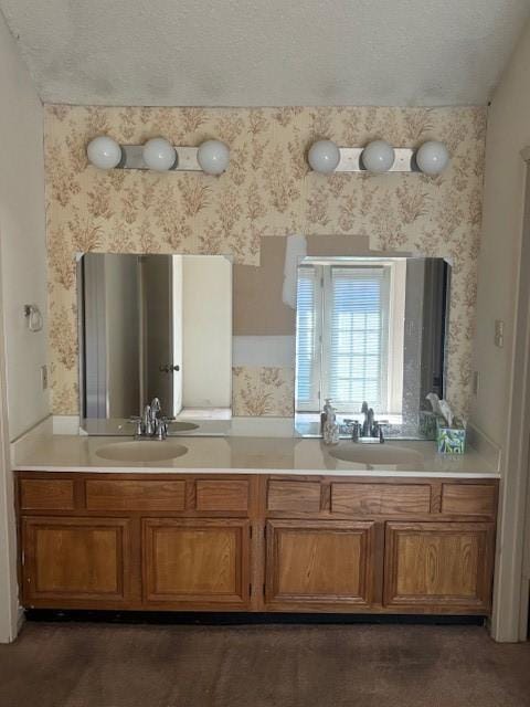 full bath featuring wallpapered walls and a sink