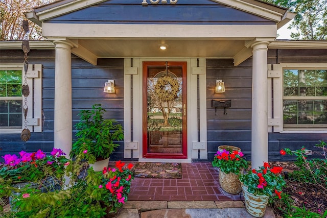 property entrance featuring covered porch