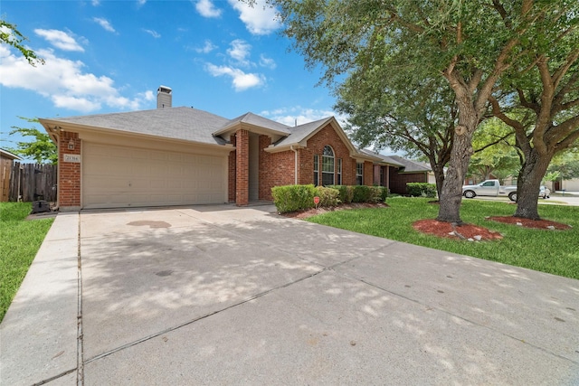 ranch-style home featuring a garage, driveway, brick siding, and a front lawn