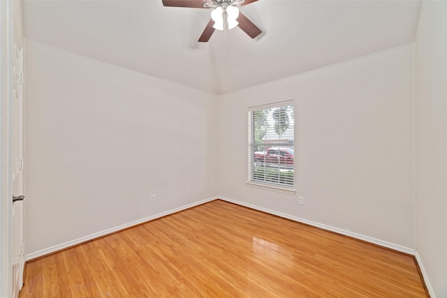 empty room featuring light wood-style floors, baseboards, and ceiling fan