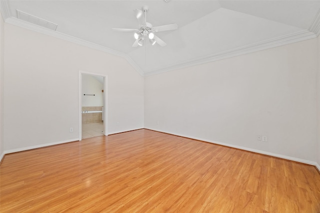 unfurnished room with light wood-style flooring, crown molding, and lofted ceiling
