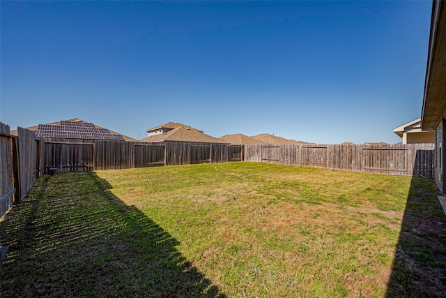 view of yard featuring a fenced backyard