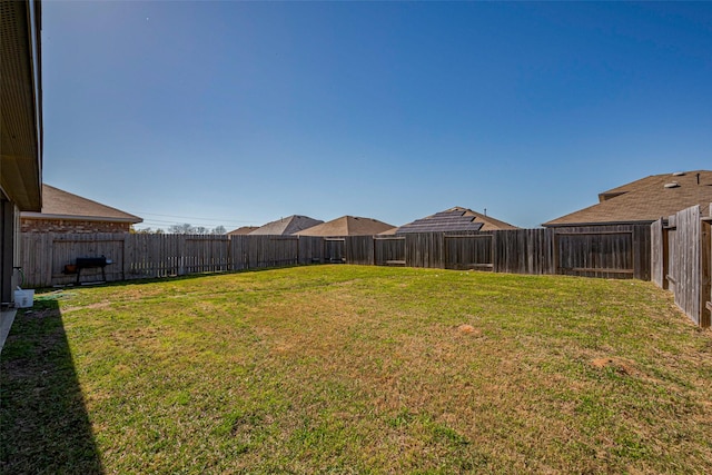 view of yard featuring a fenced backyard