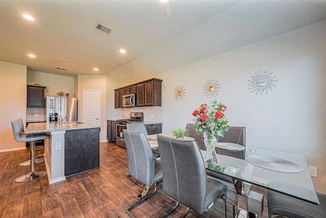 dining area with recessed lighting, dark wood-style floors, visible vents, and baseboards