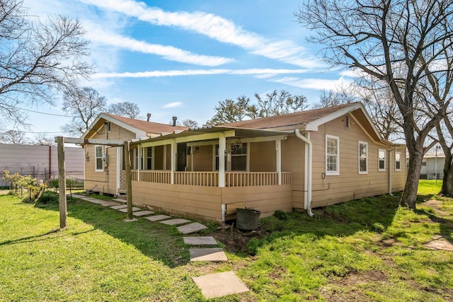 view of front of house featuring a front yard and a porch