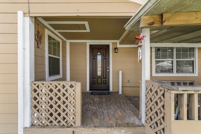 view of exterior entry with covered porch