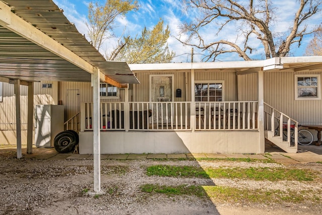 doorway to property with a porch