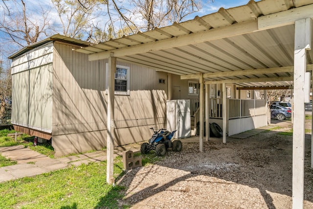 view of home's exterior featuring a carport