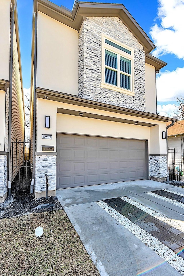 view of front of property with stone siding, stucco siding, a garage, and fence