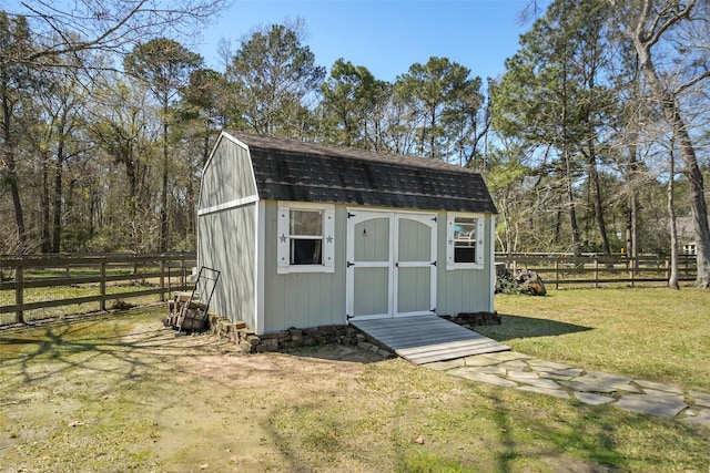 view of shed with a fenced backyard