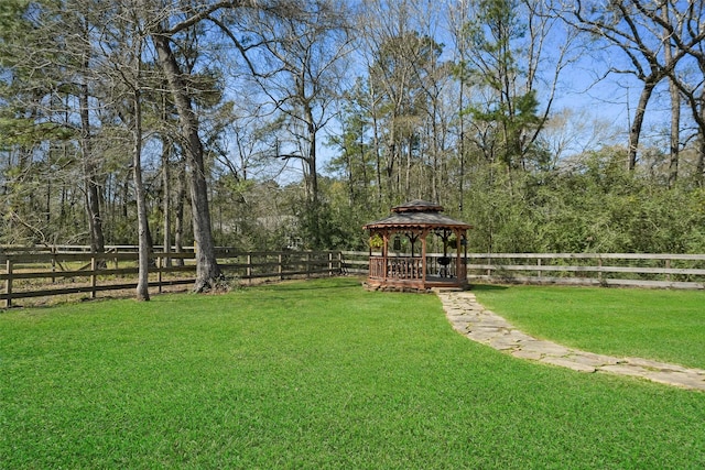 view of yard with a gazebo and fence