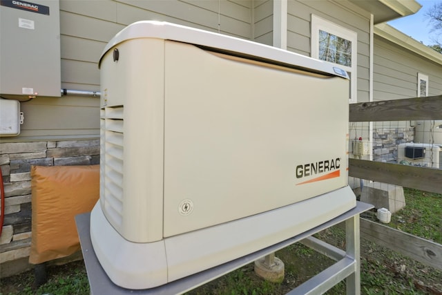 details featuring stone siding and a power unit