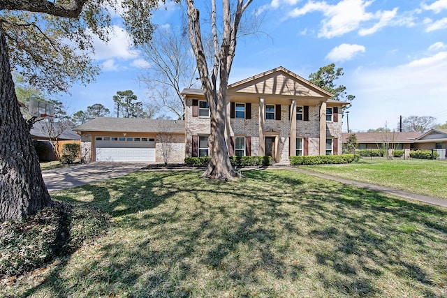 greek revival house with concrete driveway, brick siding, a garage, and a front yard