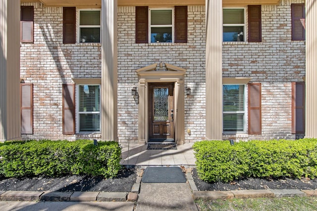 entrance to property with brick siding