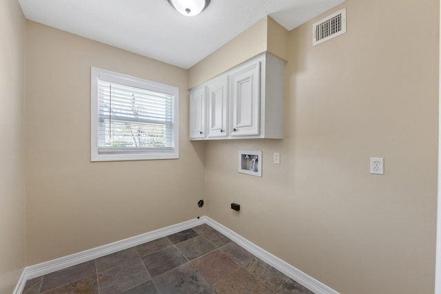 laundry room with visible vents, stone finish flooring, cabinet space, baseboards, and hookup for a washing machine