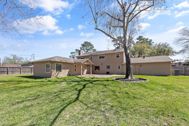 rear view of property with a patio, fence, cooling unit, a yard, and a chimney