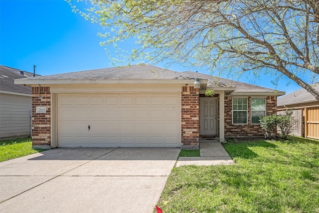 ranch-style house featuring a front yard, fence, driveway, a garage, and brick siding