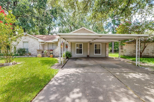 view of front of house featuring a carport, concrete driveway, a front yard, and brick siding