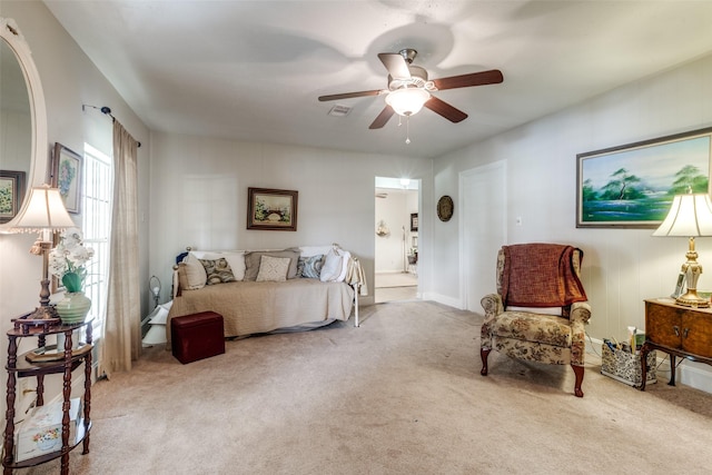 carpeted bedroom with visible vents and ceiling fan