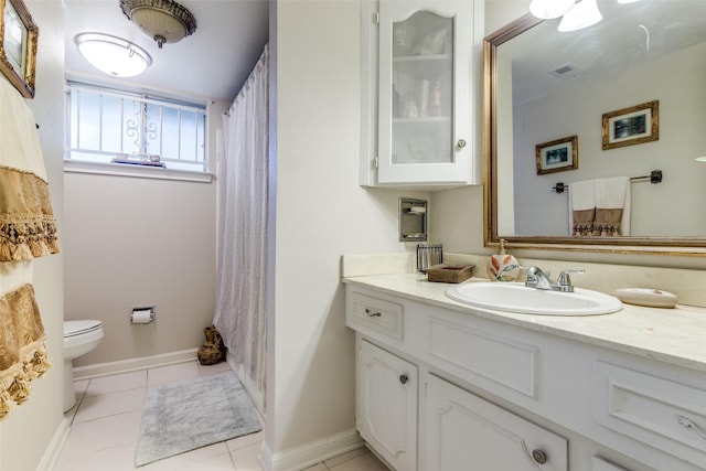 full bathroom featuring tile patterned flooring, visible vents, baseboards, toilet, and vanity