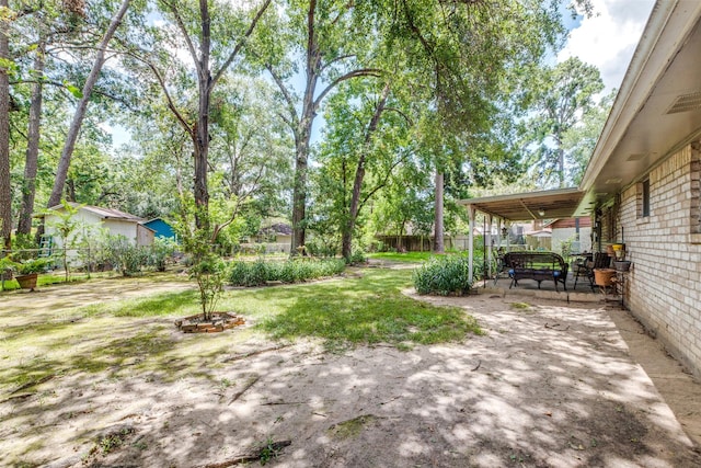 view of yard featuring a patio area and fence