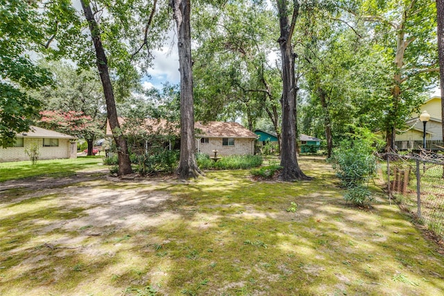 view of yard with fence