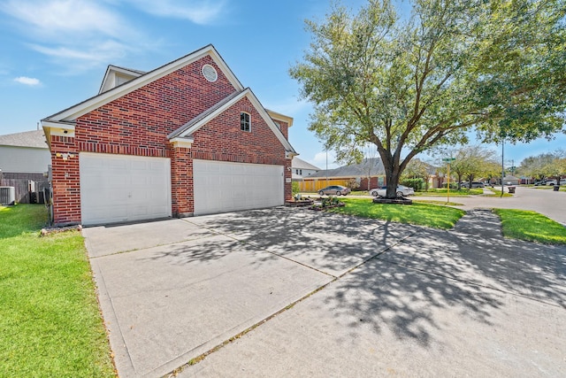 view of home's exterior with brick siding, a lawn, driveway, and cooling unit