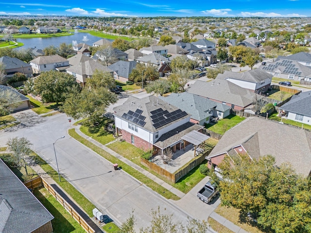 birds eye view of property featuring a residential view and a water view