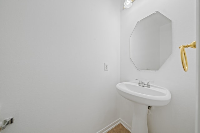 bathroom with baseboards