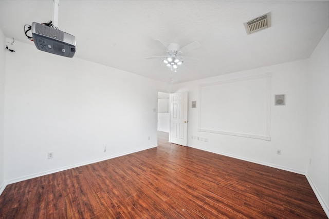 unfurnished room with visible vents, baseboards, a ceiling fan, and wood finished floors