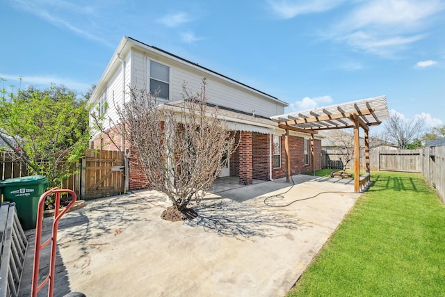 rear view of property with a lawn, a fenced backyard, a pergola, a patio, and a gate