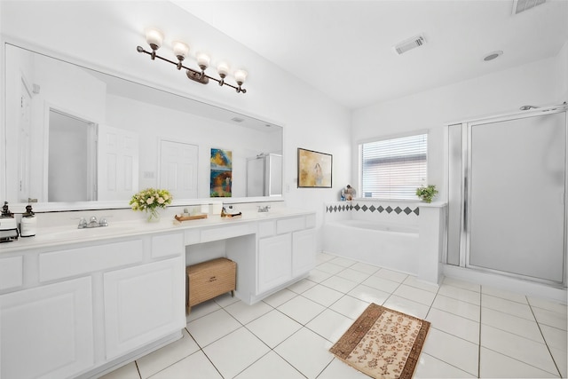 bathroom featuring visible vents, a sink, tile patterned flooring, a shower stall, and a garden tub