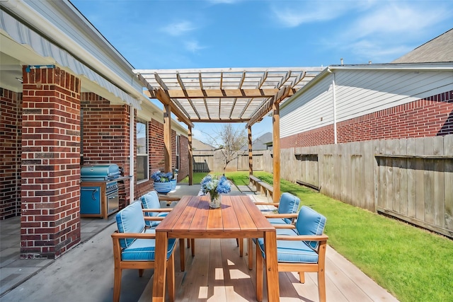 view of patio with a fenced backyard, grilling area, outdoor dining space, and a pergola