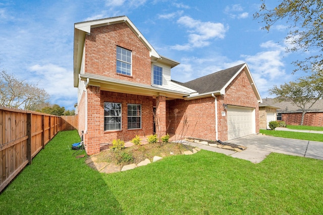 traditional-style home with a front yard, fence, driveway, a garage, and brick siding