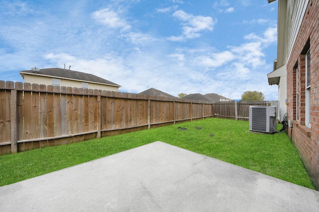 view of yard with cooling unit, a patio area, and a fenced backyard