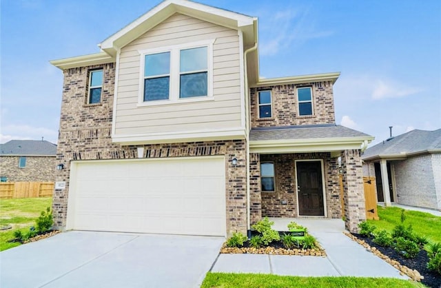 view of front of property featuring brick siding, concrete driveway, a garage, and fence